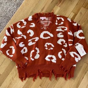 Tattered leopard print Vneck sweater